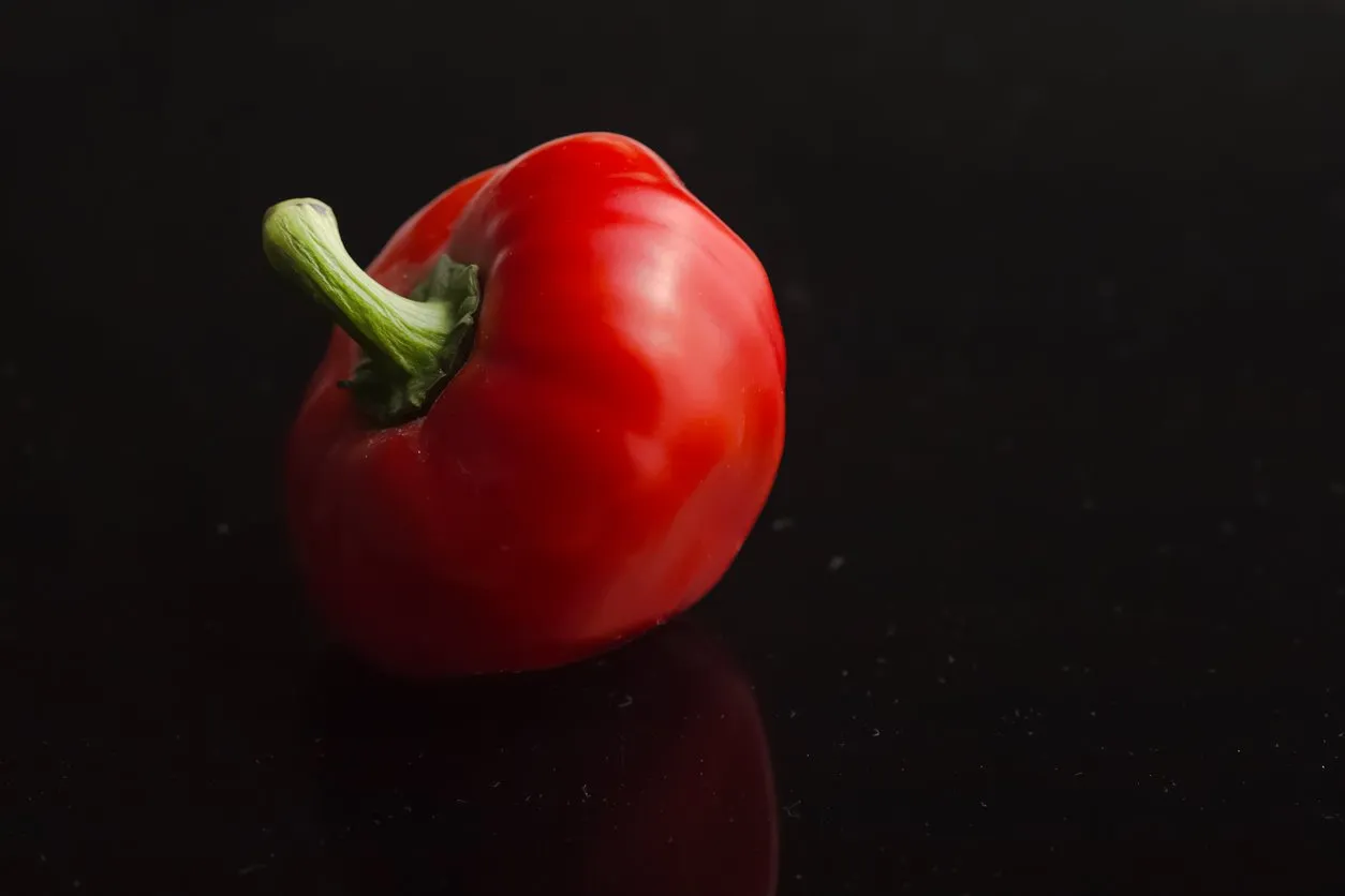 red pepper paprica isolated on black background top view