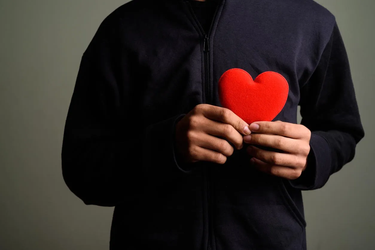 studio shot of young asian man against colored background horizontal shot