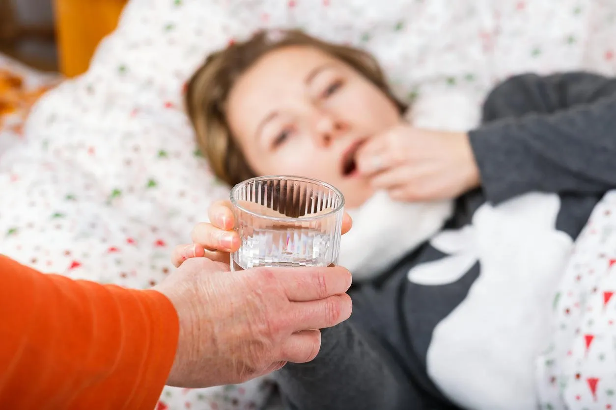 sick young woman resting in the bed