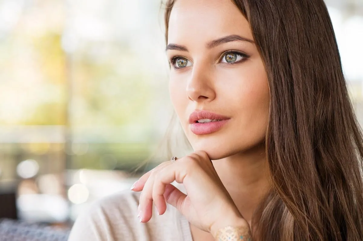 beautiful young woman outdoors in sunny day portrait of a pretty girl