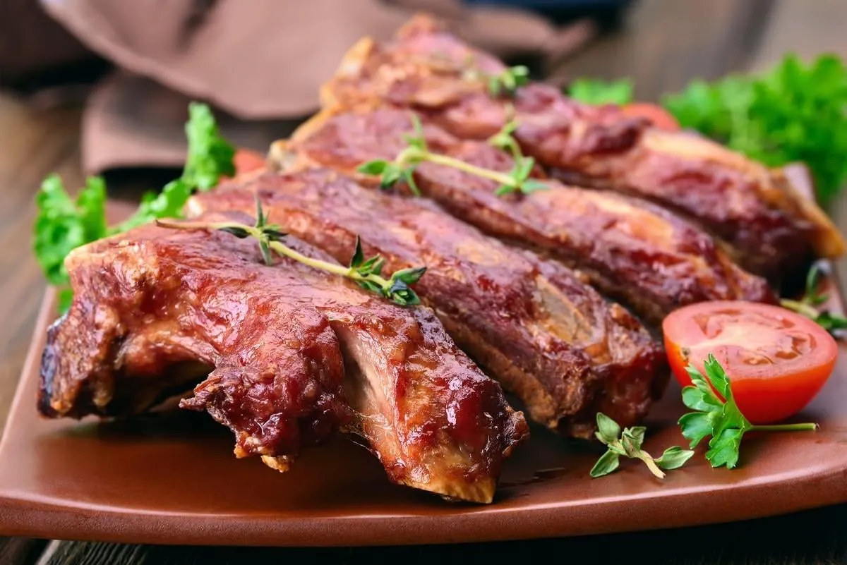 roasted pork ribs on plate, shallow depth of field