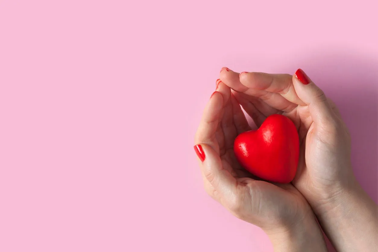 woman hands holding red heart, health care, donate and family insurance concept, world heart day, world health day, valentine's day concepts