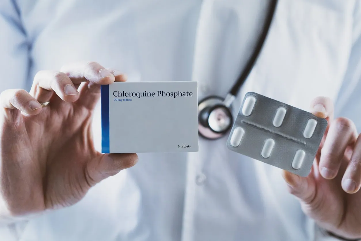 doctor holding chloroquine phosphate drug