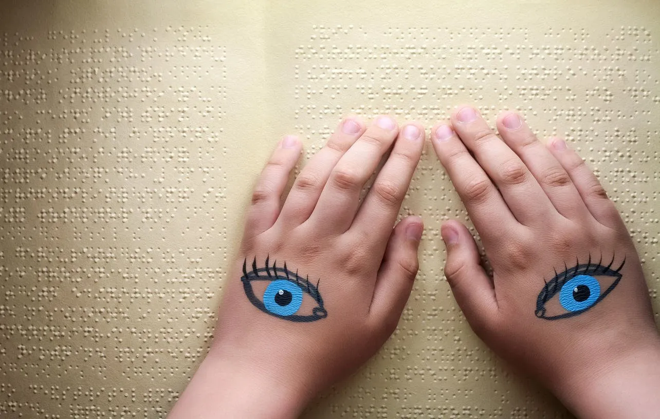 blind reading text in braille