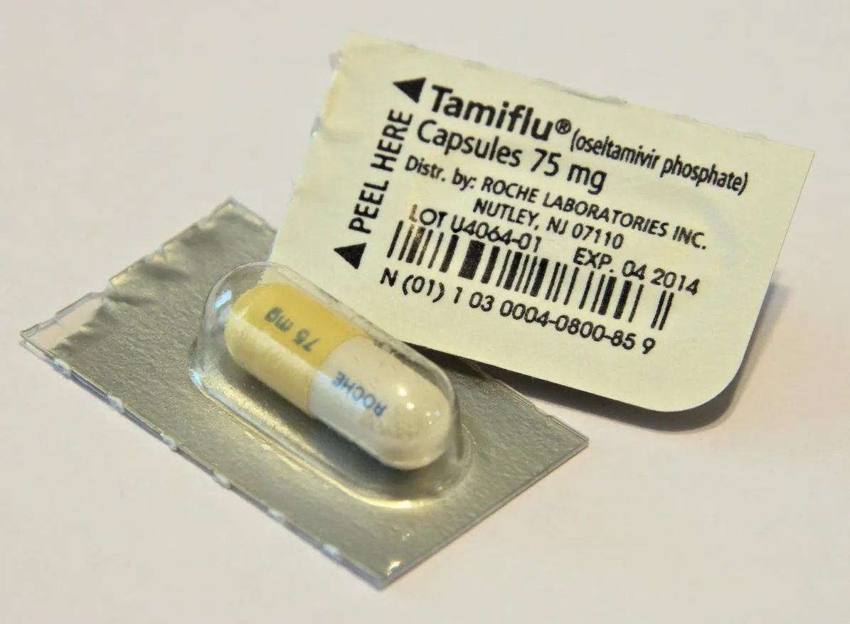 shreveport, louisiana, usa - august 26, 2016  close-up photo of the front and back of tamiflu antiviral capsule packs with an expired expiration date