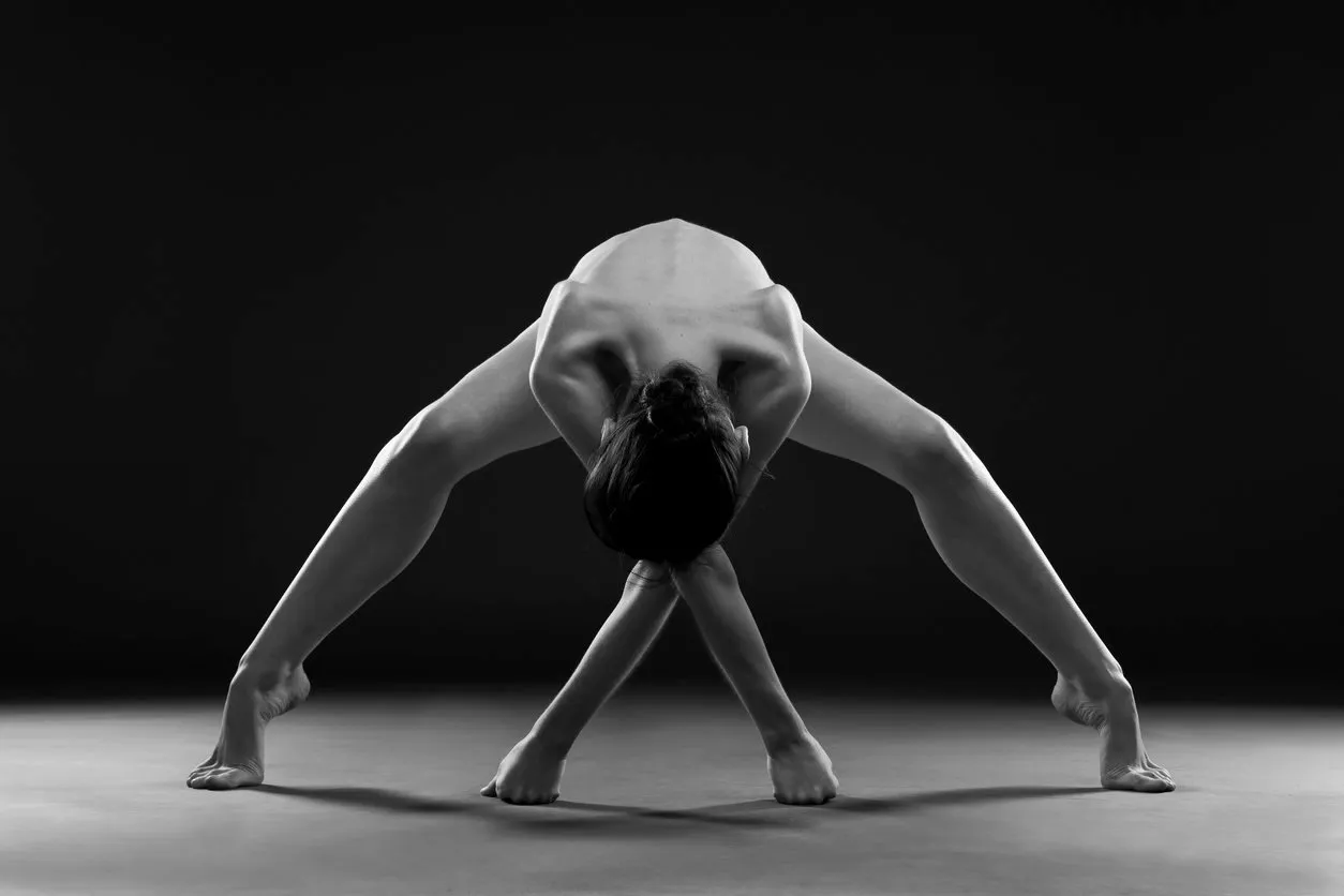 nude yoga beautiful sexy body of young woman on black background