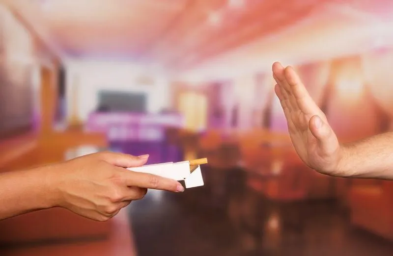 rjection of the proposal to light a cigarette in a restaurant