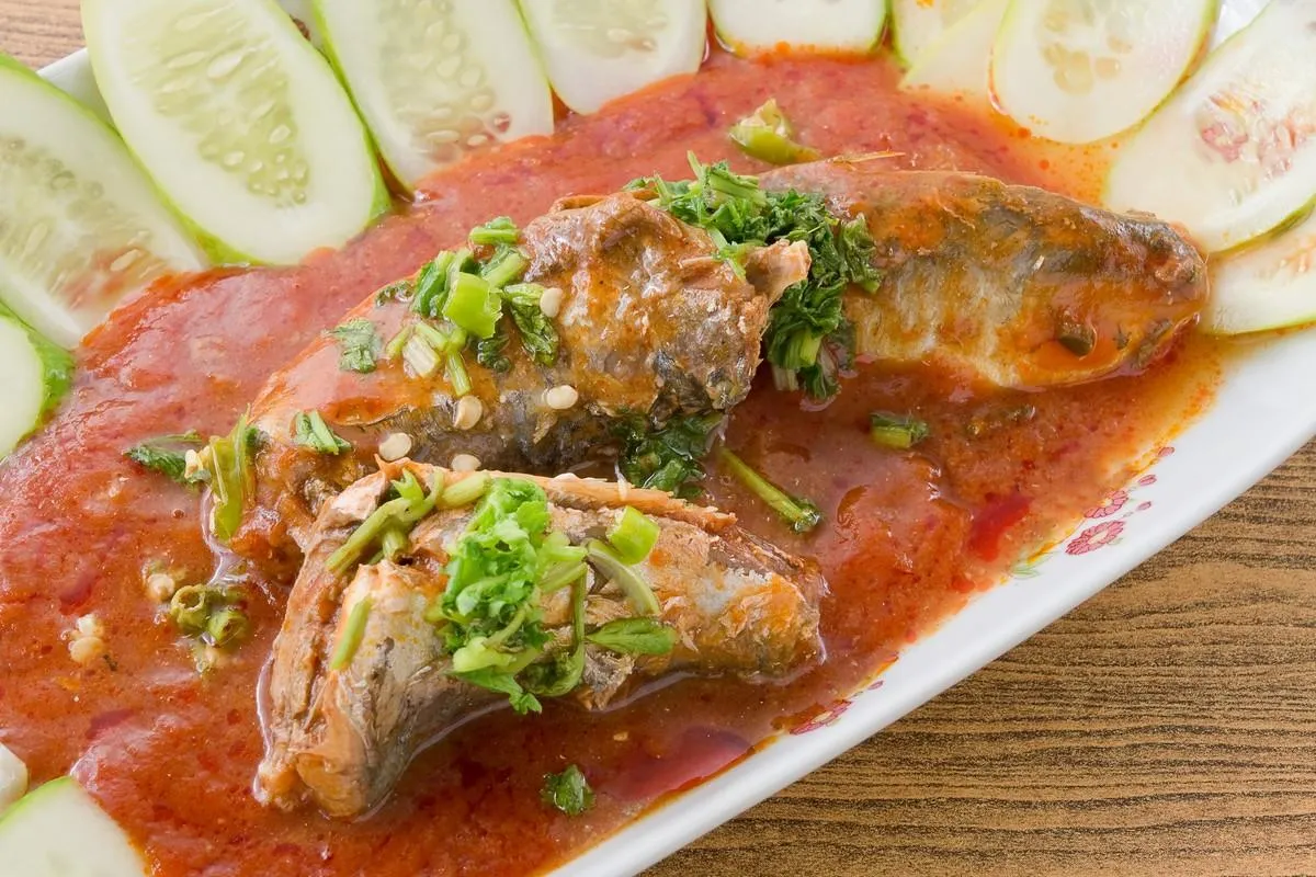 thai cuisine and food, thai sour and spicy sardines in tomato sauce salad