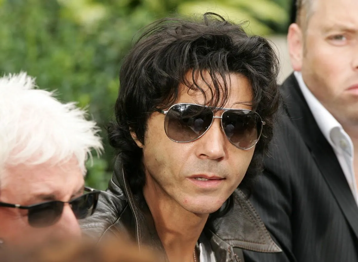 french singer jean-luc lahaye is seen during the spring-summer 2006 men's ready-to-wear collection show, 04 july 2005 in paris   afp photo   pierre verdy