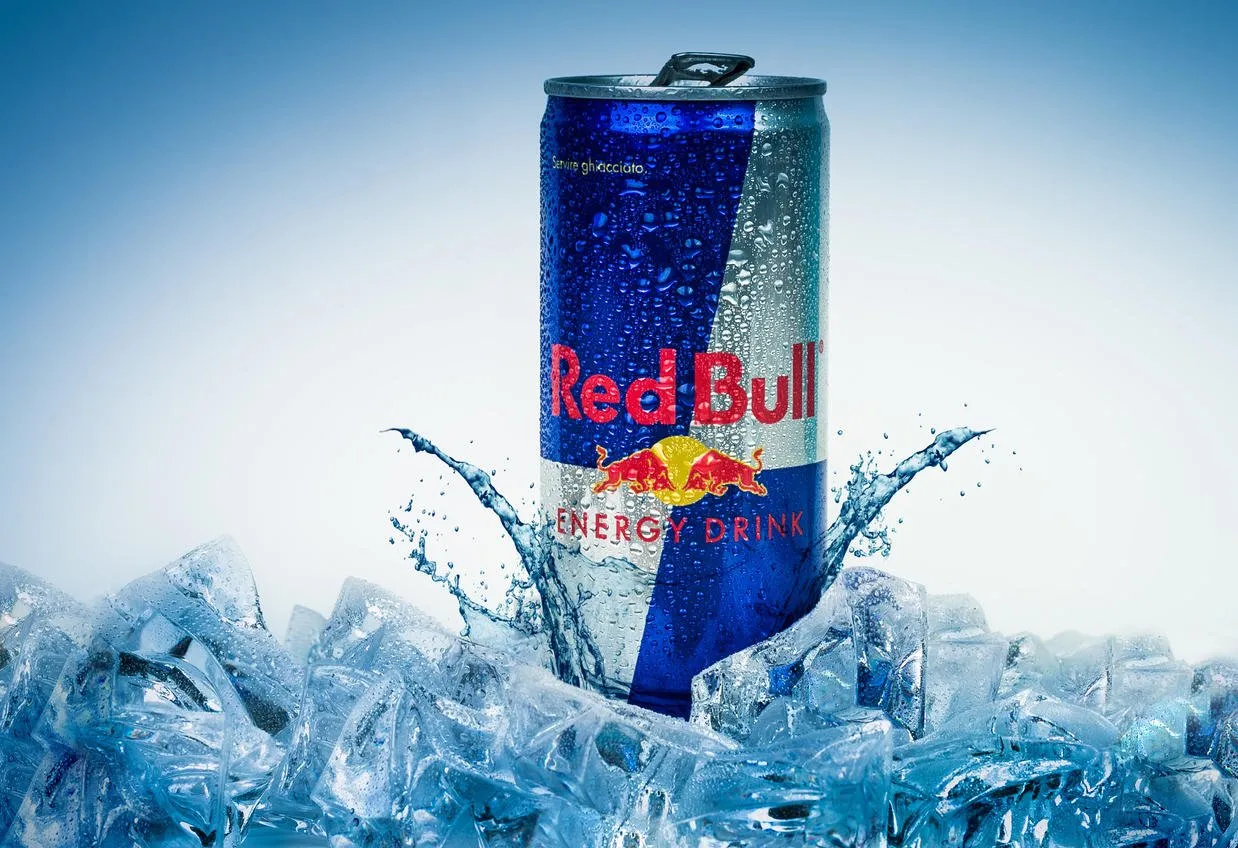 trieste, italy - may 29, 2016  aluminium can of red bull energy drink iced backgroundred bull is the most popular energy drink in the world, with 5,226 billion cans sold in