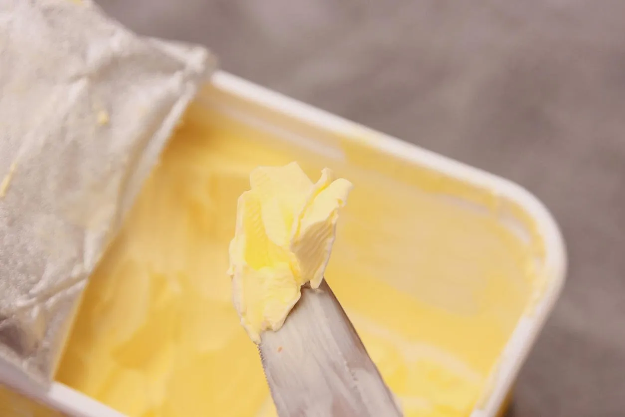 yellow butter on silver knife