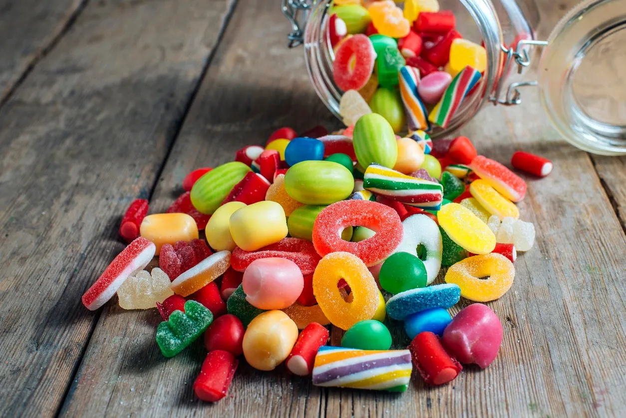colorful candy gum on old wooden table