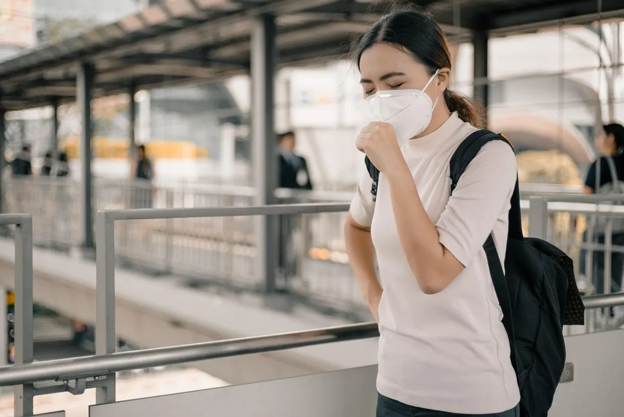 woman wearing a mask