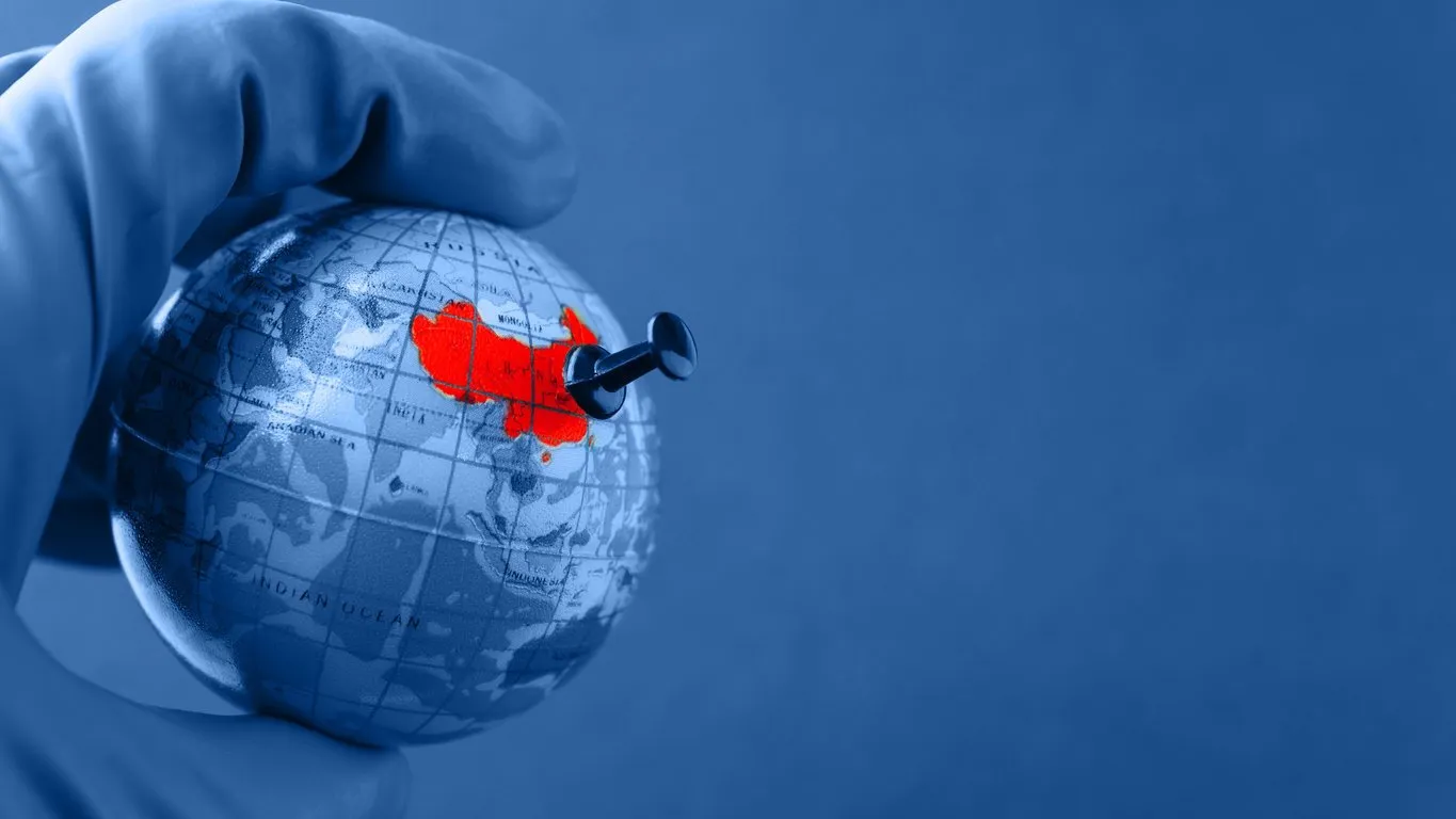 the epicenter of the corona virus in china, indicated on the mini globe, a place for text