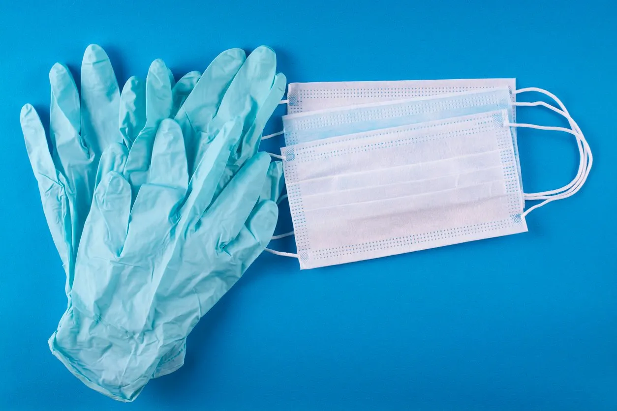 medical bandages and gloves on a blue background