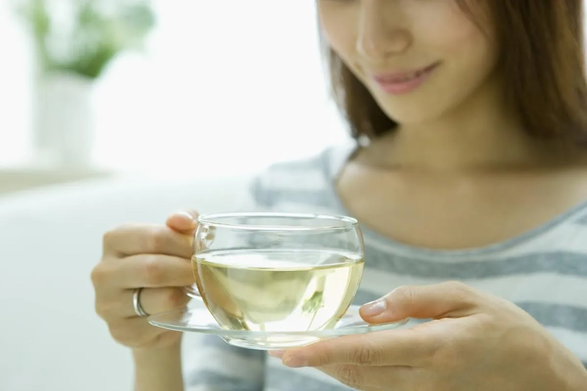 woman drinking herb tea
