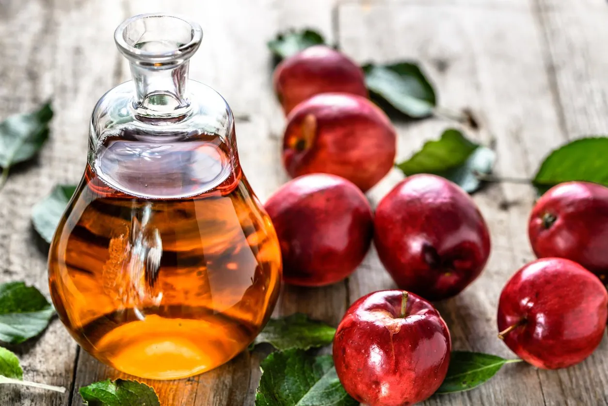 apple cider vinegar or bottle of alcohol drink from fresh apples, organic food, healthy diet concept