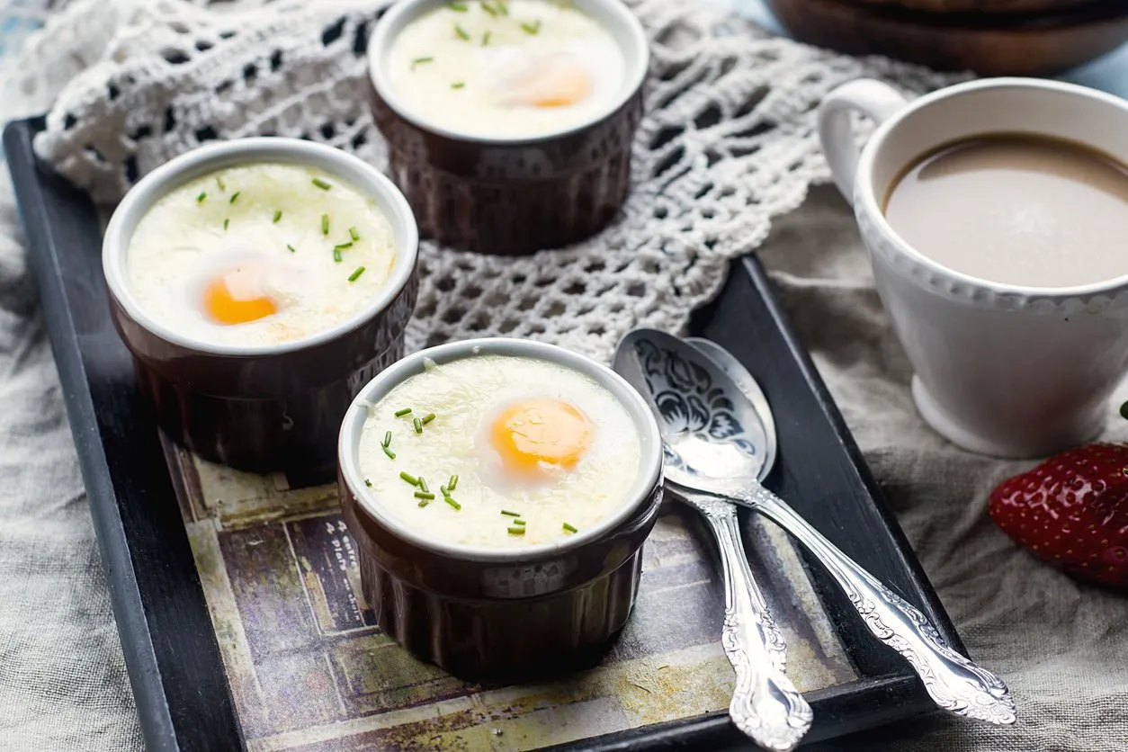 shirred baked eggs for breakfast with coffee