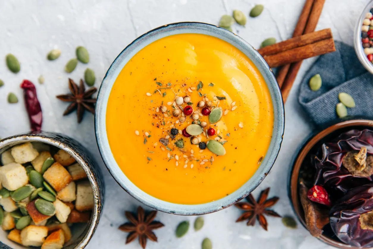soup with sweet potatoes, carrots, pumpkin flat lay, top view