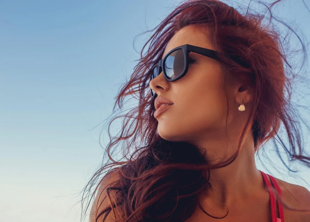 close up portrait of brunette woman in a sunglasses