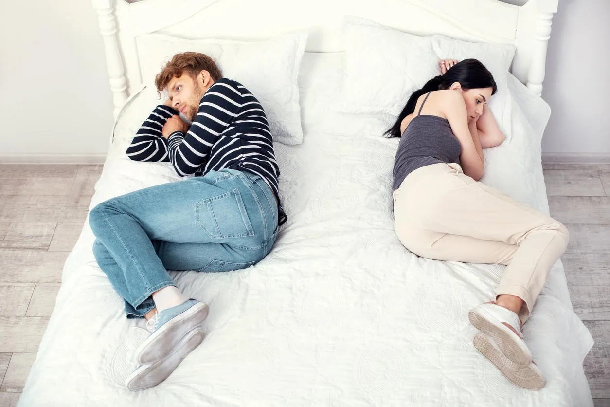 ready to divorce unhappy nice couple lying on the bed while thinking about a divorce