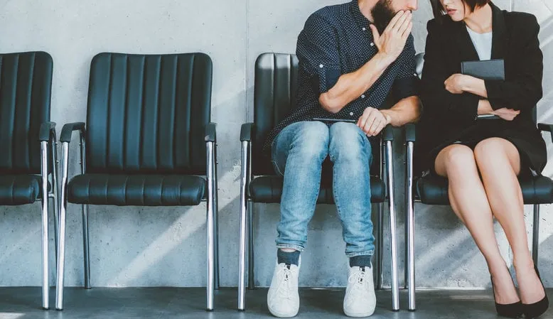 business integrity corporate gossips secrets man whispering to female colleague ear