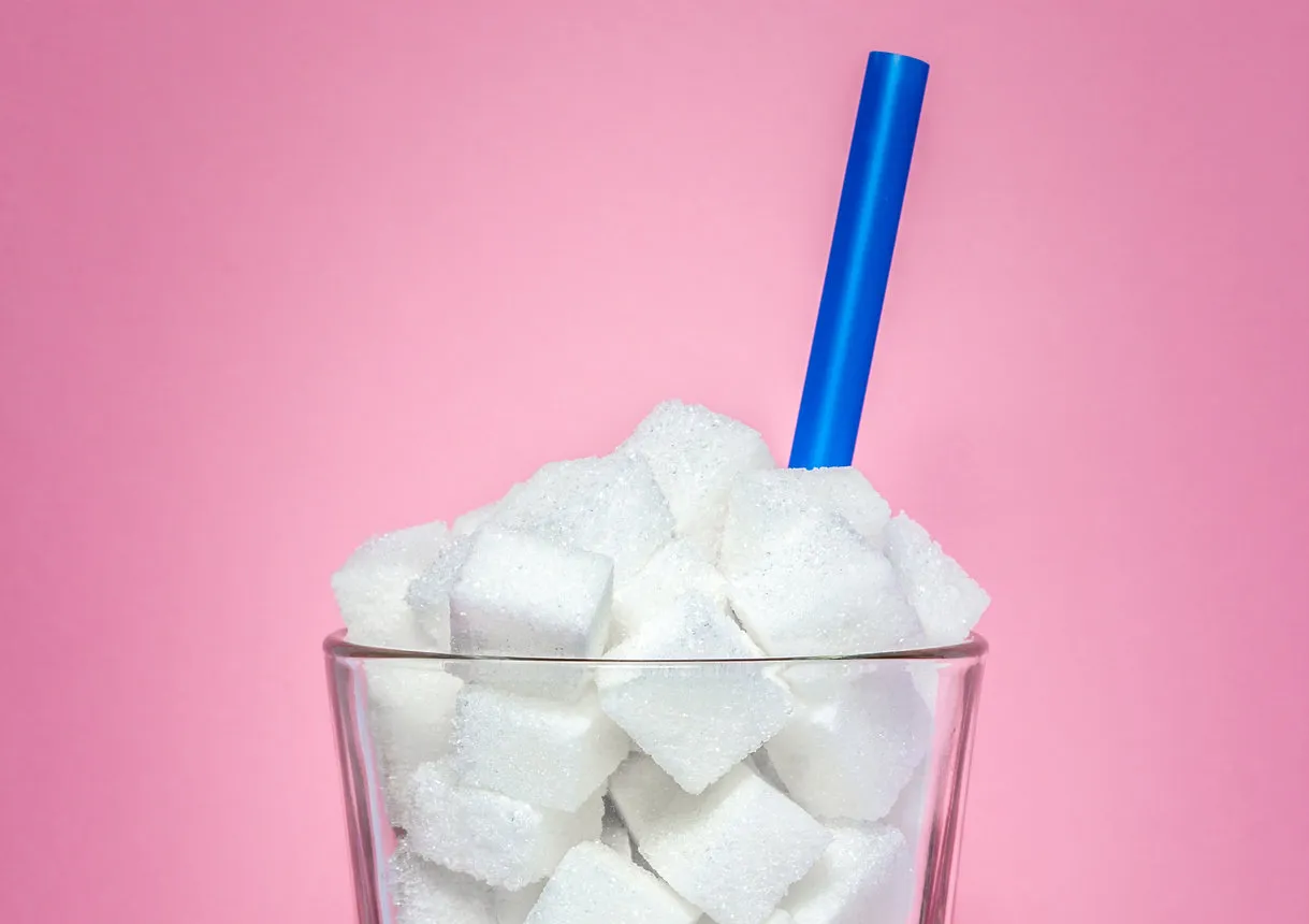 glass full of sugar cubes - unhealthy diet concept