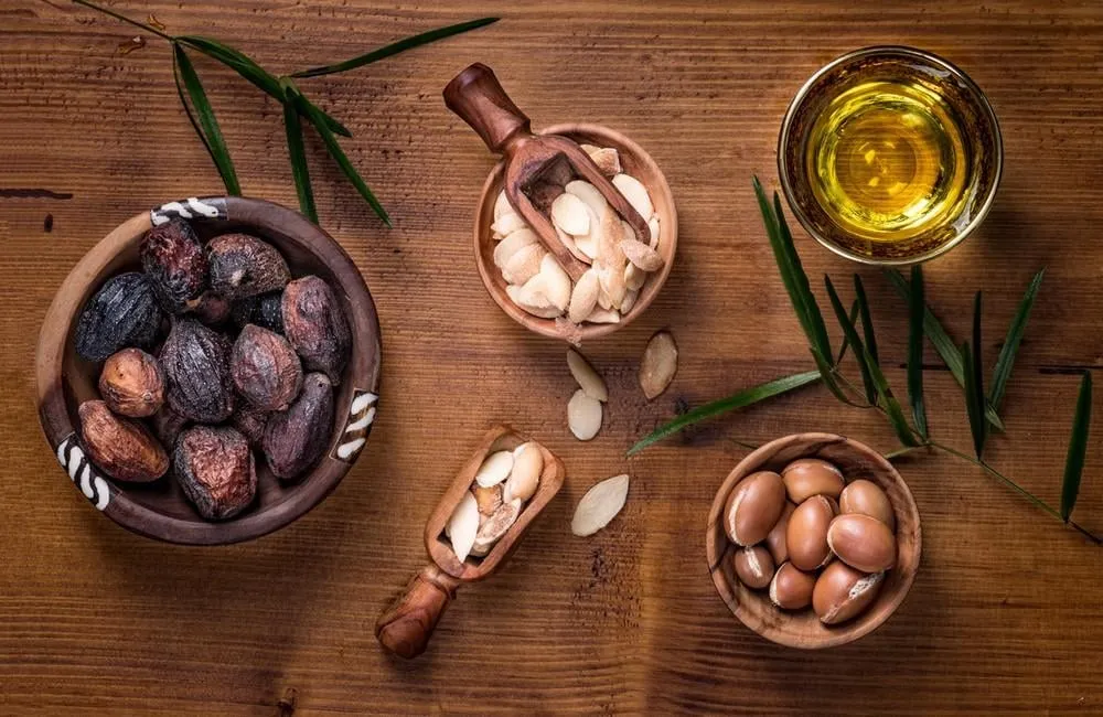 composition of argan fruits, seeds, oil, cream and soap fot skin care