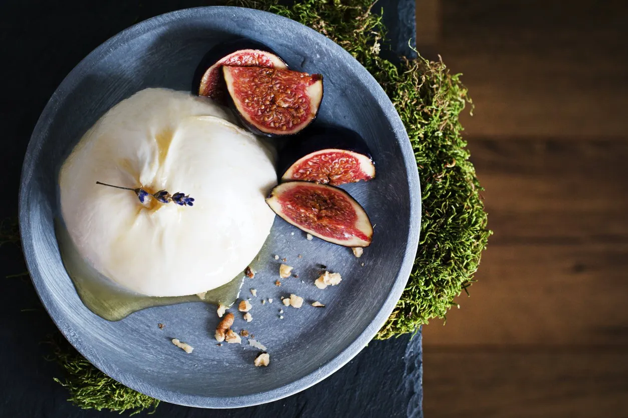 italian cheese (burrata) served with fresh figs, walnuts and lavender honey