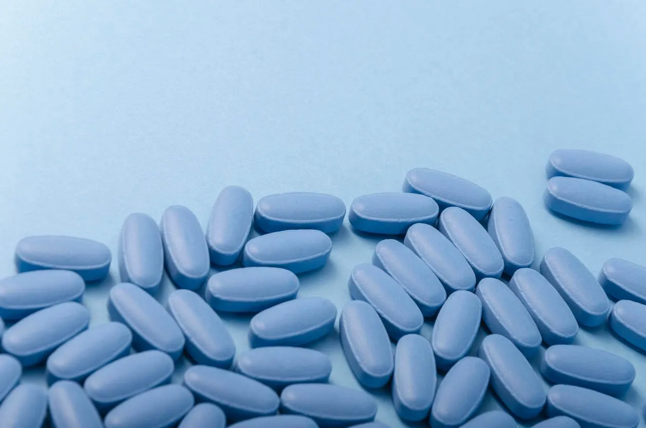 random composition of blue tablets over a light blue background, empty space for text