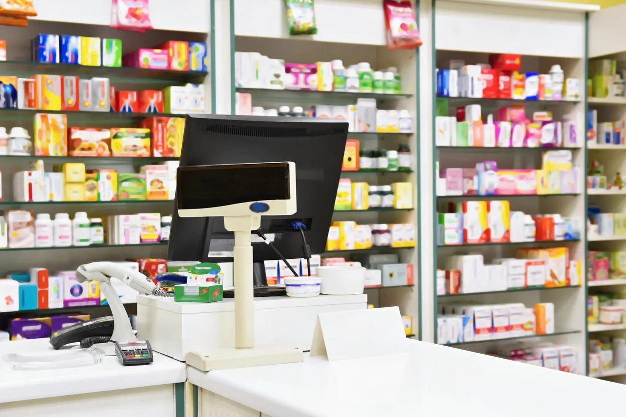 cash desk - computer and monitor in a pharmacy interior of drug and vitamins shop medicines and vitamins for health and healthy lifestyle