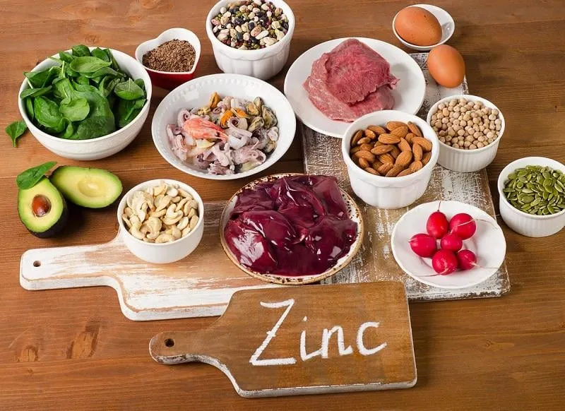 foods with zinc mineral on a wooden table top view