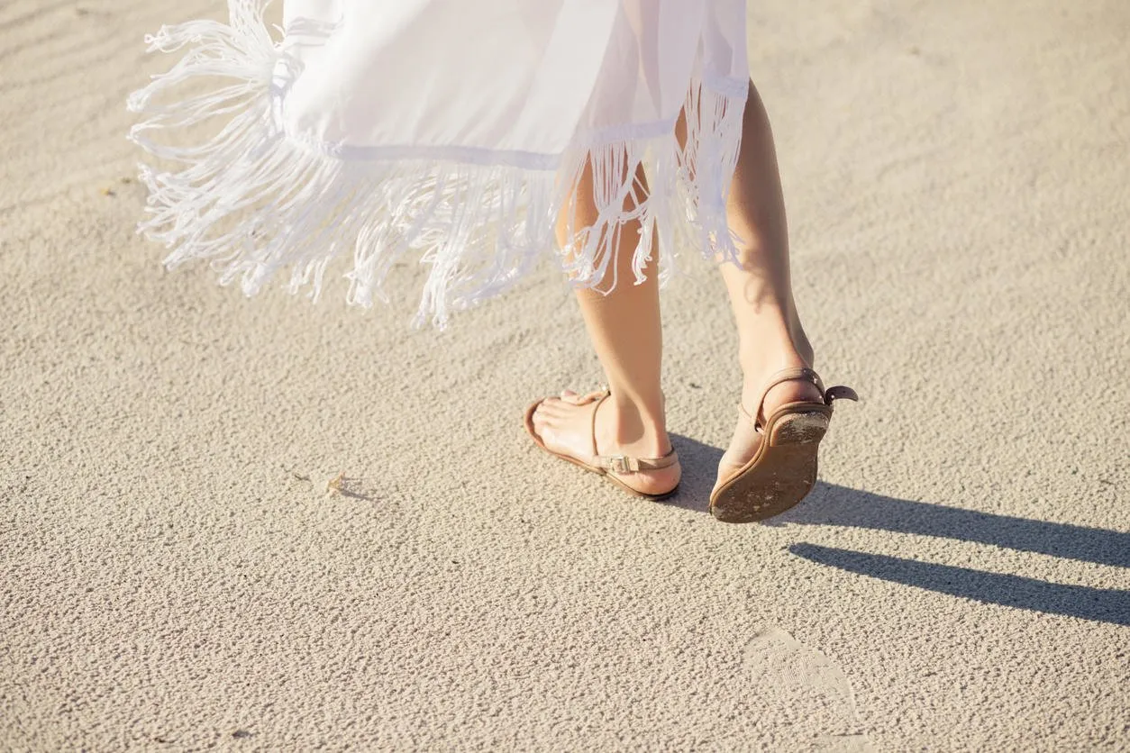 trip alone woman walking away on a sand in desert