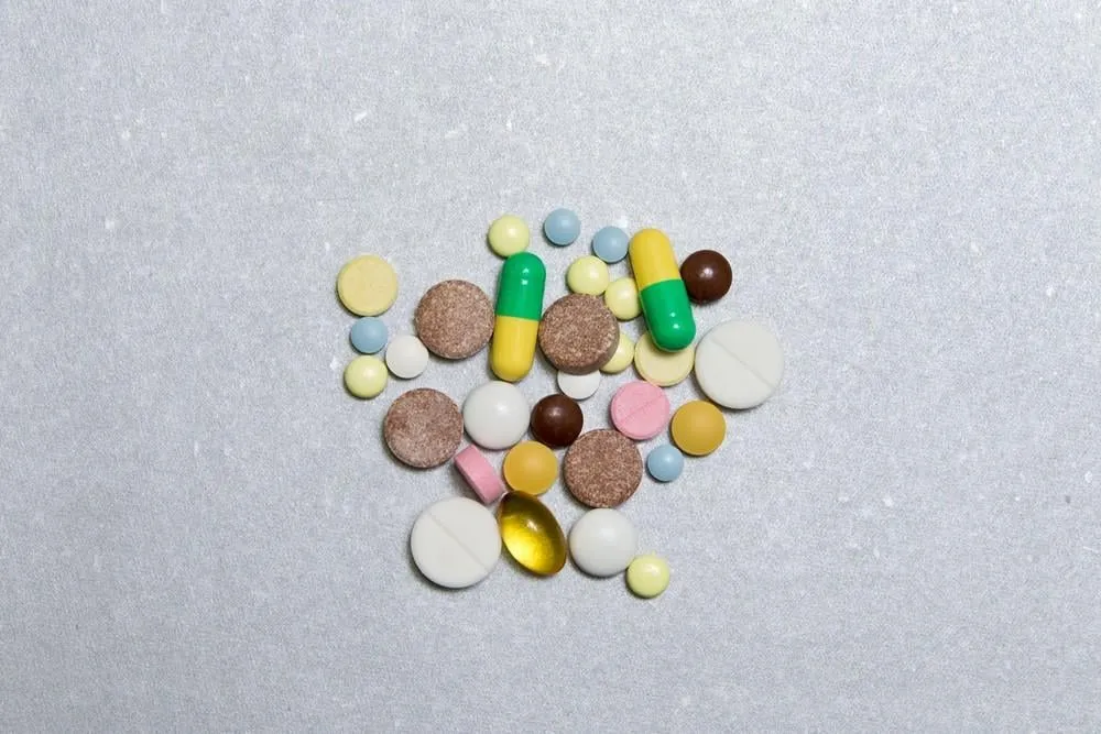 opioid pills colored pills on a silver backgroundthe concept of opioid epidemic