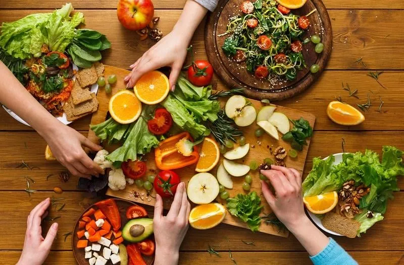 healthy food dinner table women at home together, eating fruits and vegetables, top view, flat lay, crop