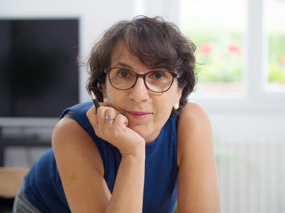 a portrait of a mature woman with glasses