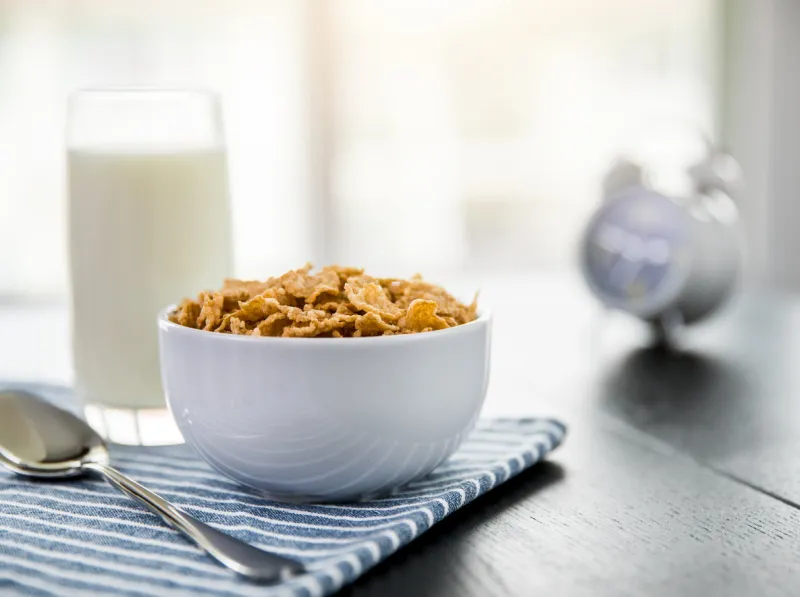 healthy corn flakes with milk for breakfast on table, food and drink