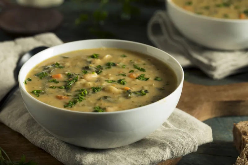 homemade white bean soup with parsley and bread