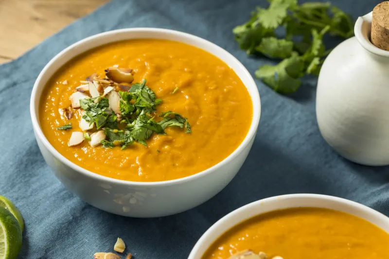 homemade thai sweet potato soup with cilantro and almonds