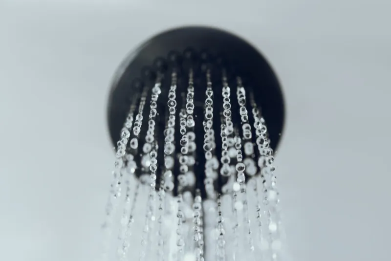 shower head with water drop flowing