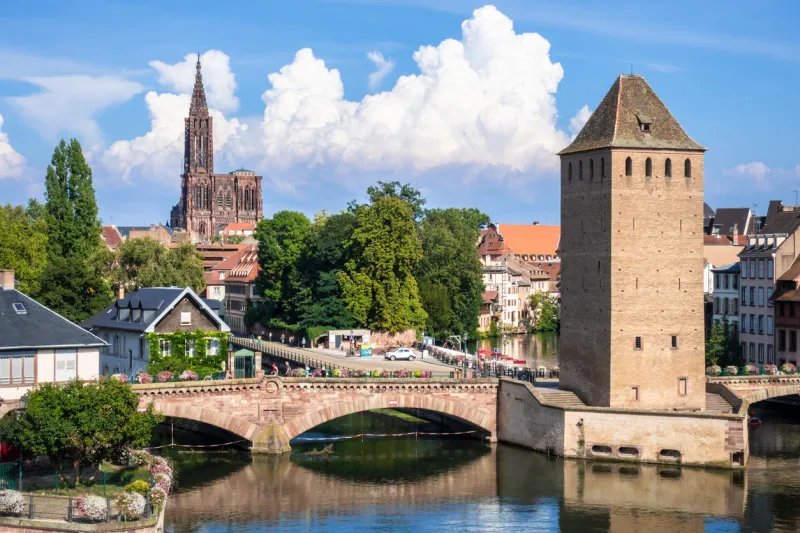 an image of a strasbourg scenery water towers