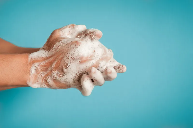 man washing hands, studio shot