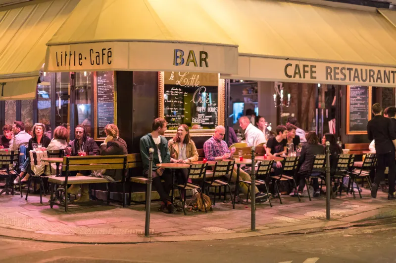 paris, france - may 11, 2017  people at a street restaurant at night