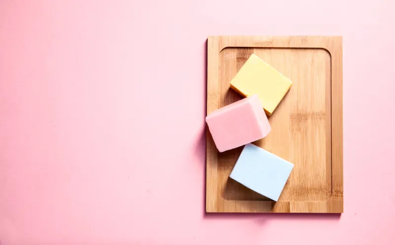 natural hand made soaps lying on the wooden desk