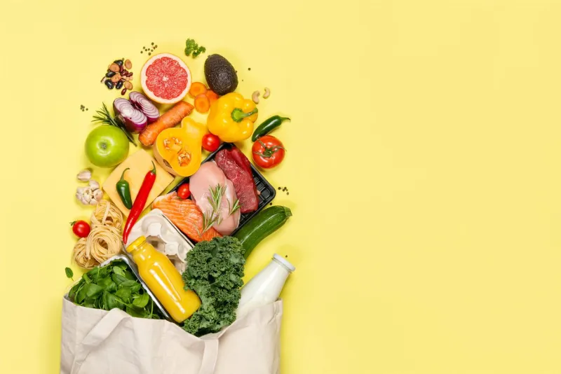 grocery shopping concept - meat, fish, fruits and vegetables with shopping bag, top view