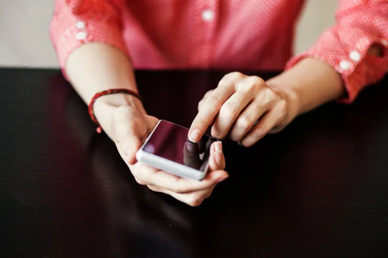 young woman using smart phone