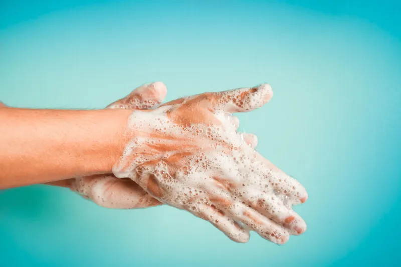 closeup of person washing hands isolated cleanliness and body care concept