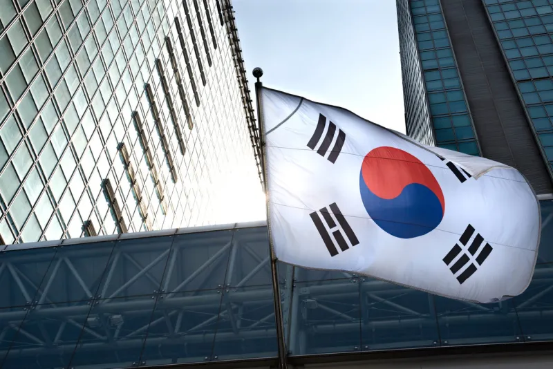 the korean flag hanging in a high-rise building