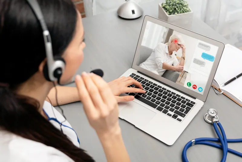 doctor talking with a senior patient telemedicine concept