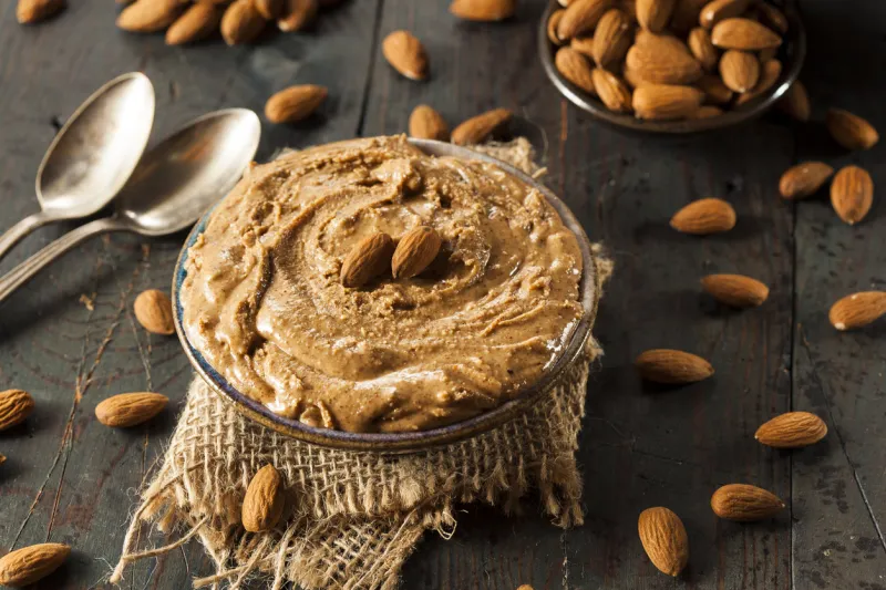 raw organic almond butter on a background